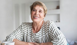 Smiling senior woman with dental braces