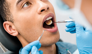 dentist examining patients teeth