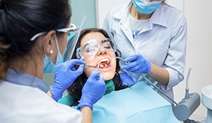 woman getting dental treatment and being completely relaxed