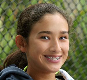 adolescent girl smiling with braces