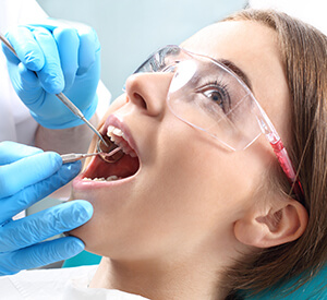 Young lass getting dental examination