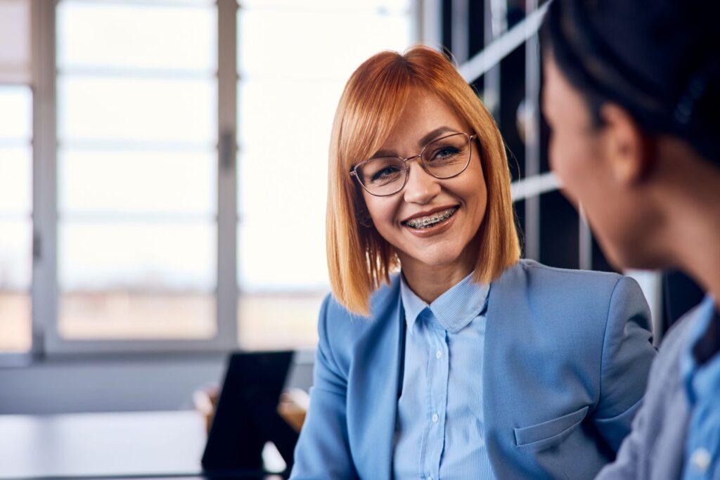 A woman with braces in a professional office.